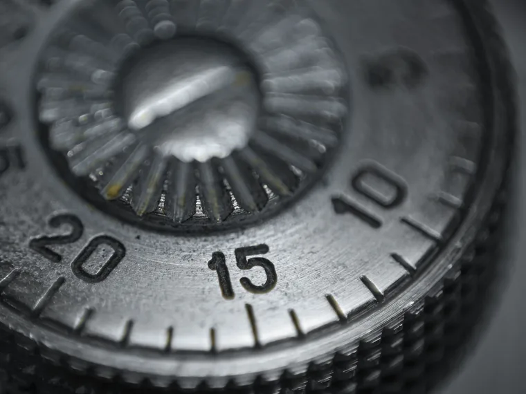 A combination dial, the index mark at the top of the numbers.