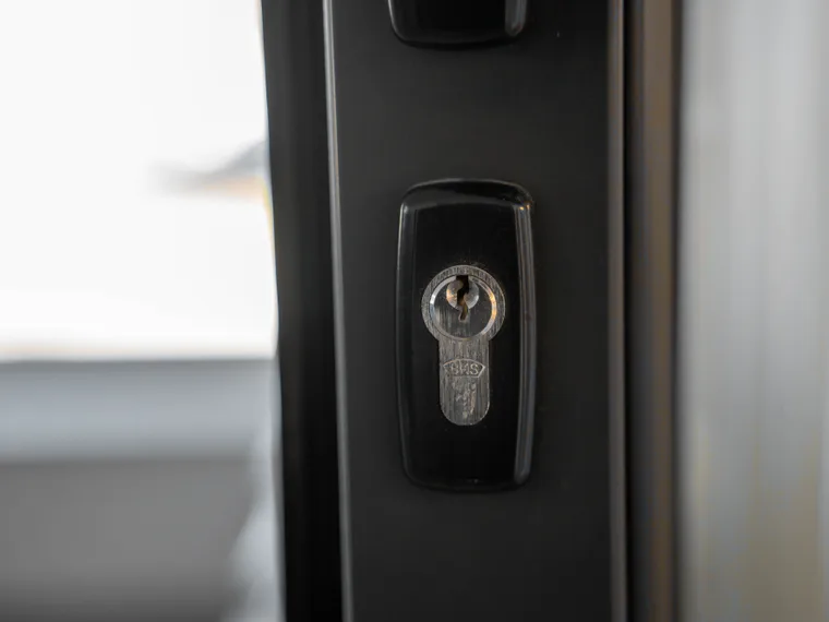 A euro cylinder in the face of a composite front door.